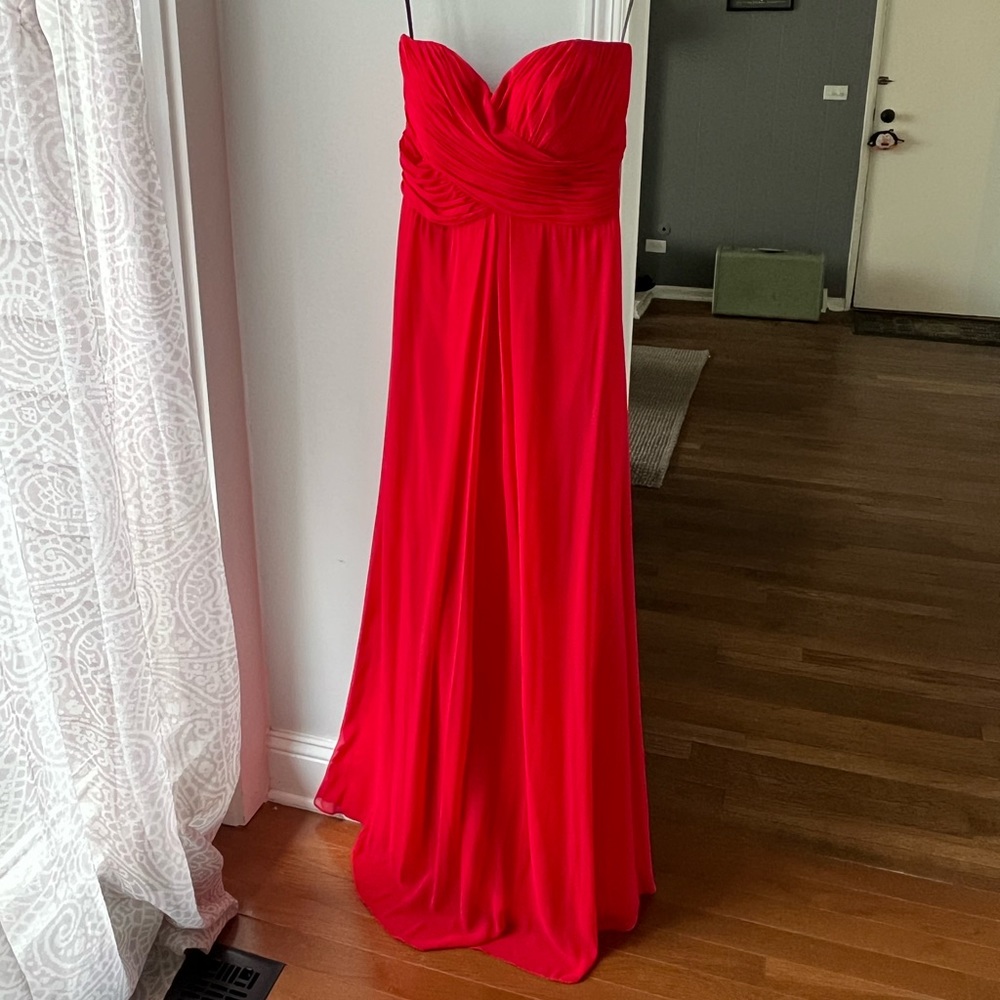 Dessy collection red strapless formal gown. 53 inches in length. Cups sewn in.